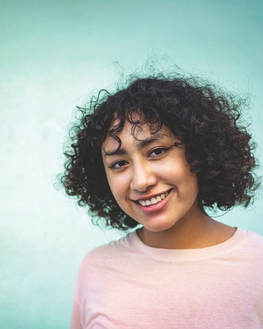 Woman with afro hair smiling